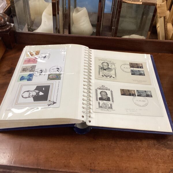 Vintage postcard album featuring Winston Churchill and other collectible postcards.
