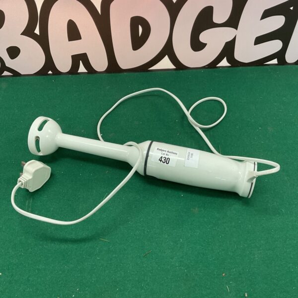 Vintage Braun electric mixer, a classic kitchen appliance.