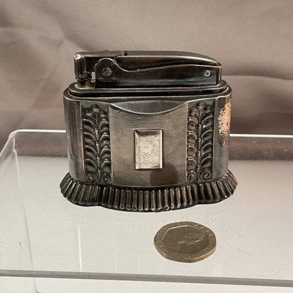 Vintage silver Ronson Diana table lighter with geometric design.