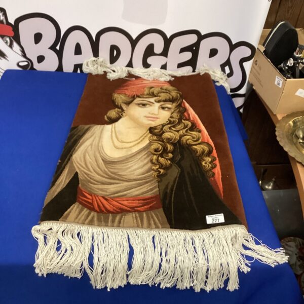 Vintage lady portrait rug with tasseled edges for home decor.