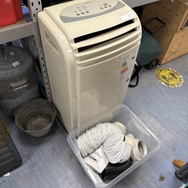 White Homebase portable air conditioner with hose and attachments.