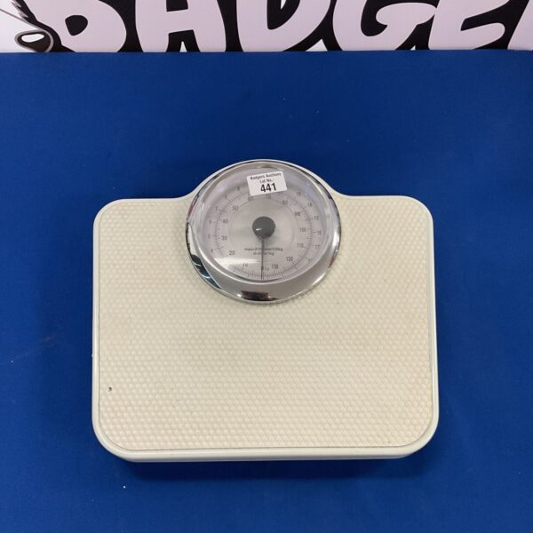 Vintage Coopers mechanical bathroom scale with circular weight display.