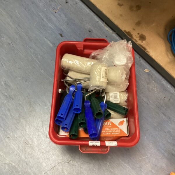Mixed lot of paint roller refills and disposable gloves for DIY projects.