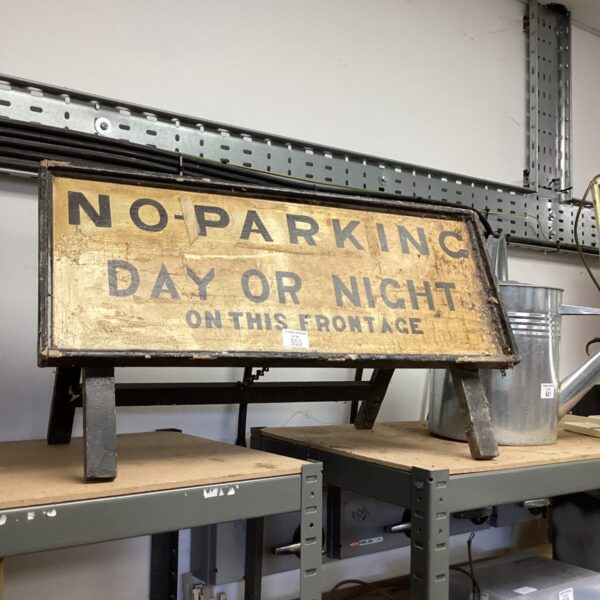 Vintage yellow “No Parking Day or Night” metal street sign.