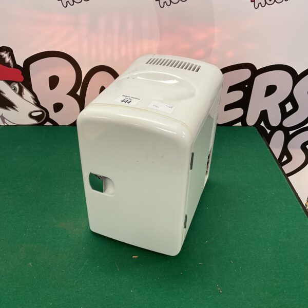 Front view of a white Naiko mini fridge.