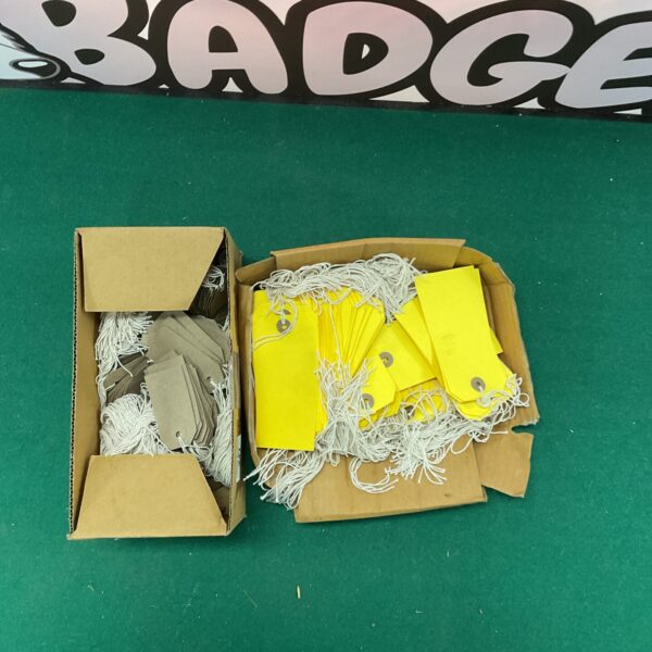 Lot of yellow and white paper tags for crafting and collecting.