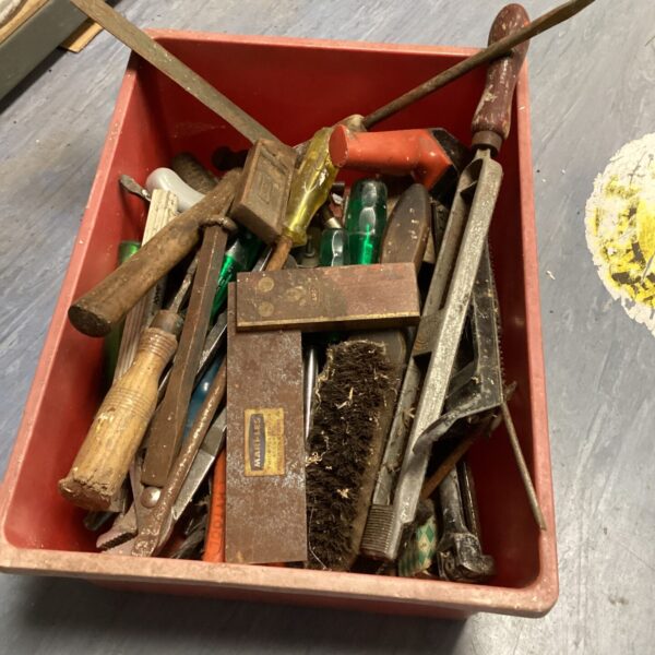 Vintage hand tool lot with chisels, screwdrivers, and hammer.