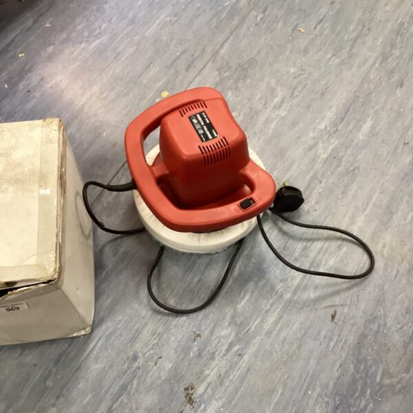 Vintage orbital car polisher for automotive detailing and paint care.