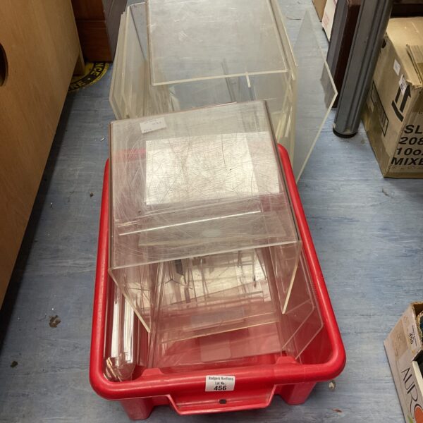 Clear perspex display rises in a quantity lot for shop displays.