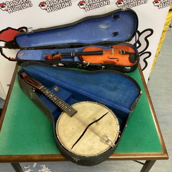 Vintage banjolin and violin set with cases for collectors.