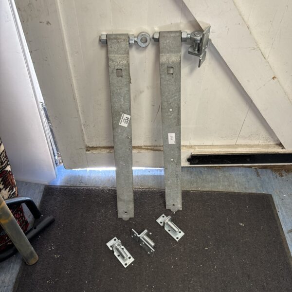 Pair of large galvanised gate hinges for garden or farm use.