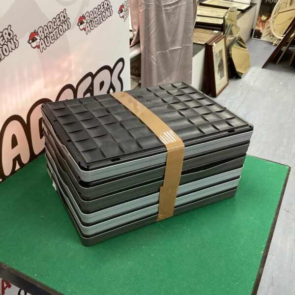 Stack of used folding plastic crates for storage.