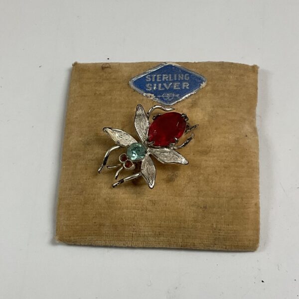 Vintage sterling silver bee brooch with a colourful stone.