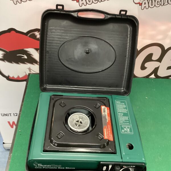 Portable single burner gas camping stove for outdoor cooking.