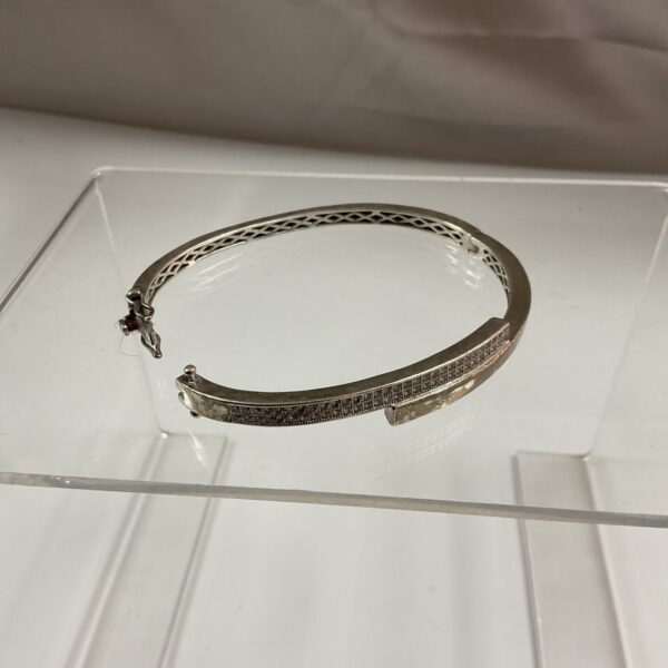 Hallmarked silver bracelet with white stone setting.