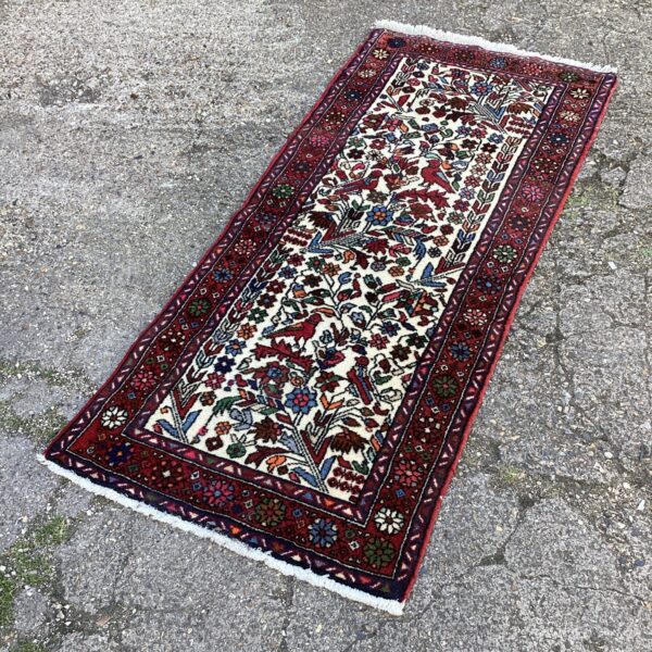 Vintage floral rug with intricate handwoven botanical patterns.