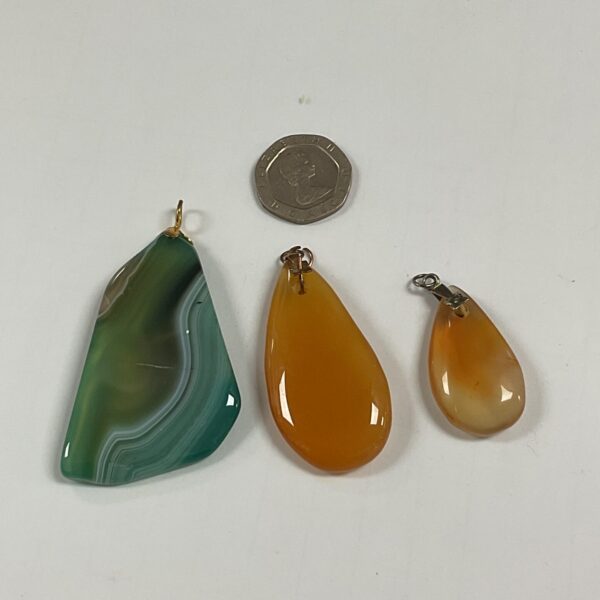 Vibrant green agate pendant with natural stone patterns.