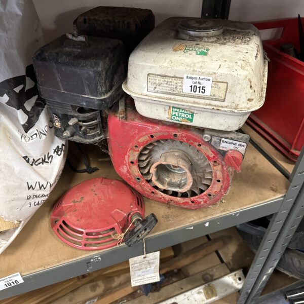 Vintage Briggs & Stratton petrol lawnmower engine for spares and repairs.