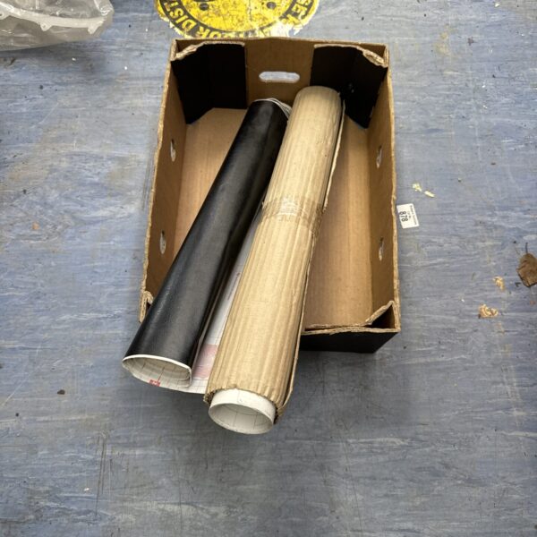 Black sticky back vinyl sheet with window privacy film roll.