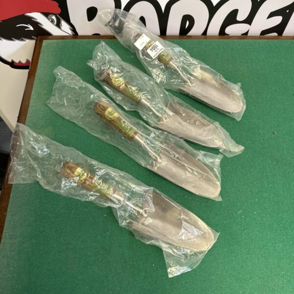 Lot of four new Draper Expert garden trowels in packaging.