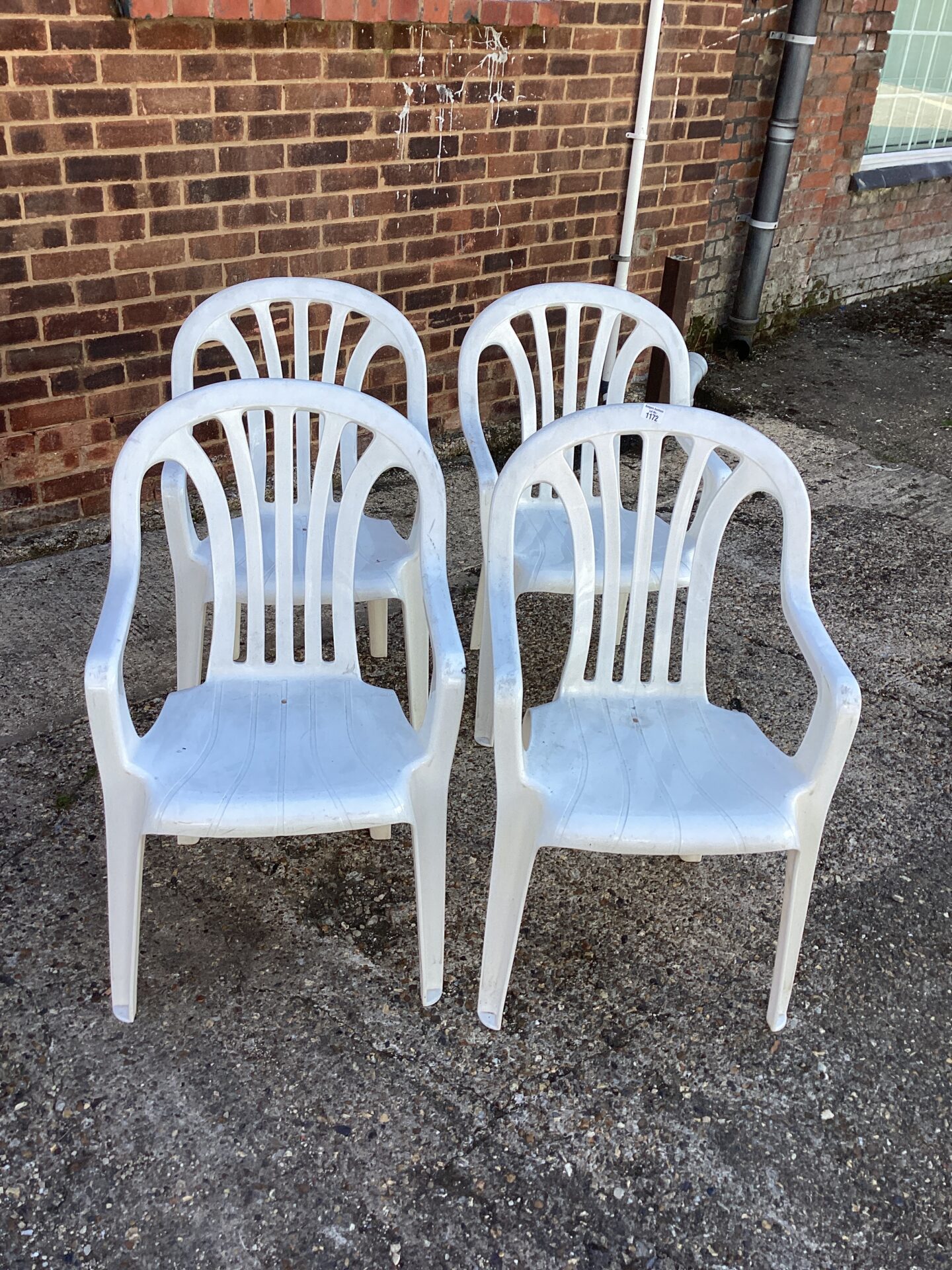 1172 Four White Platic Garden Chairs