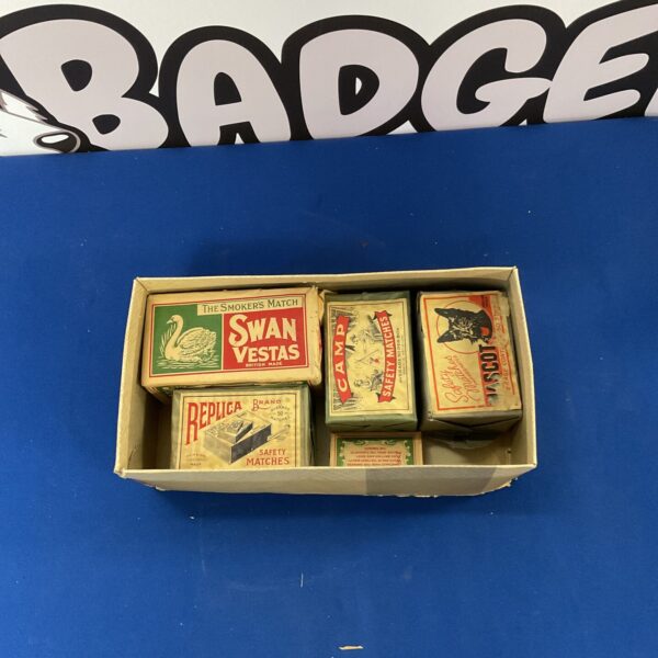 Vintage sealed matchboxes from Swan Vestas, Camp, and Mascot brands.