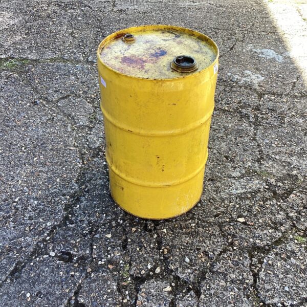 Vintage yellow oil drum, small metal container for collectors.