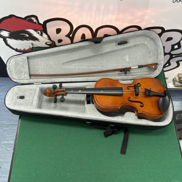 Vintage unbranded violin in a worn hard case with bow.