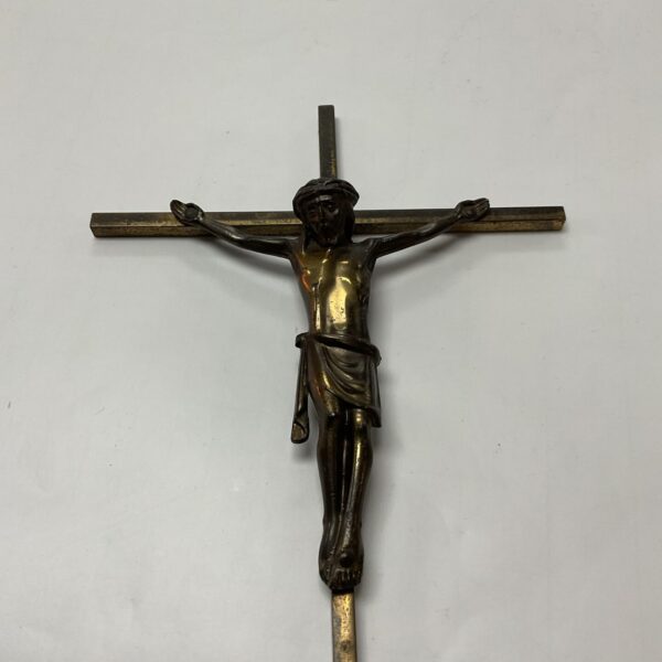 Vintage brass crucifix depicting Jesus Christ on the cross.
