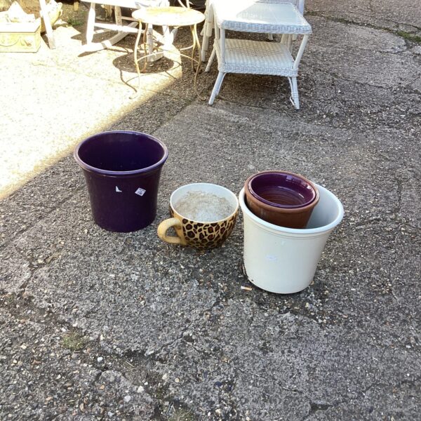 Vibrant purple vintage enamelware garden pot for plants.