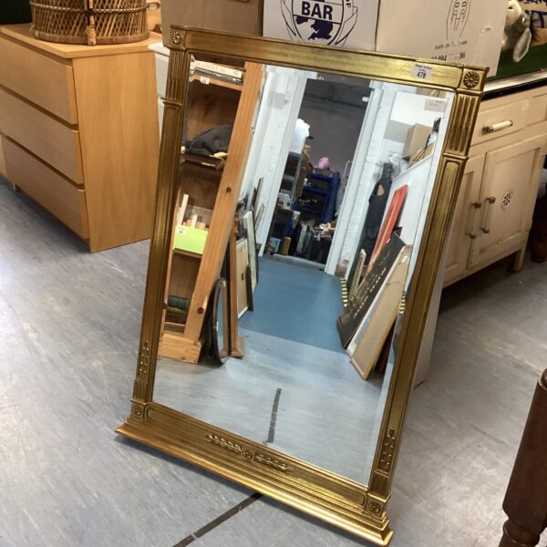 Antique gilt wall mirror with ornate frame, vintage home decor.