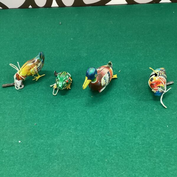 Vintage clockwork tin duck, a colourful post-war German toy.
