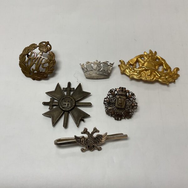 Vintage military cap badges lot, collectible insignia for enthusiasts.