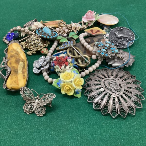Vintage costume jewellery lot with silver butterfly brooch.