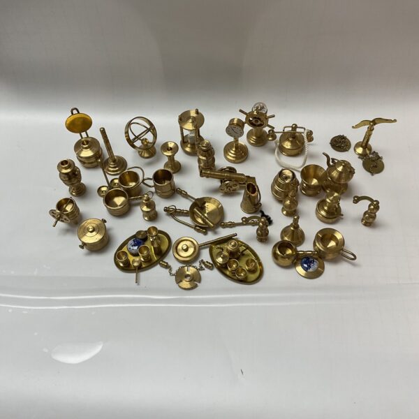 Large collection of vintage brass miniature dolls house items for collectors.