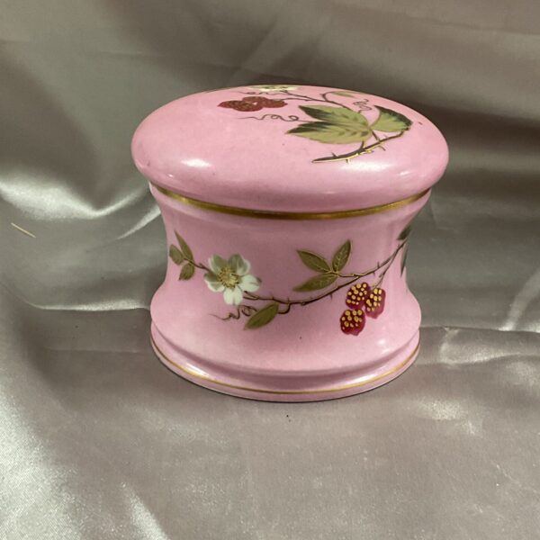 Antique pink porcelain pot with strawberry decoration.