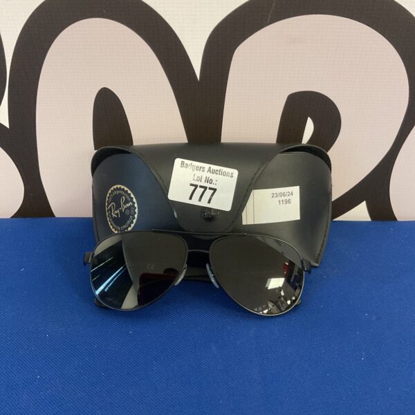 Vintage Ray Ban Aviator sunglasses in their protective case.