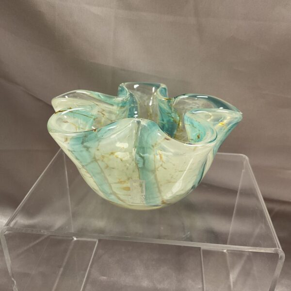 Vintage Medina glass bowl with a wavy rim and colourful swirls.