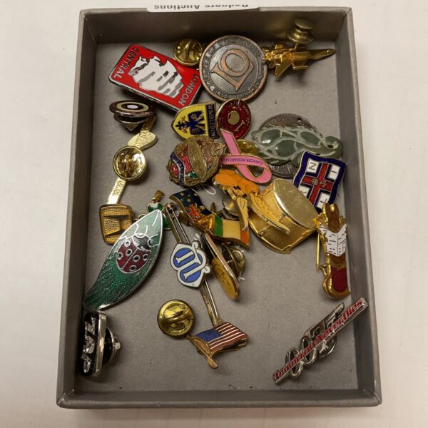 Collection of vintage British military badges and insignia.