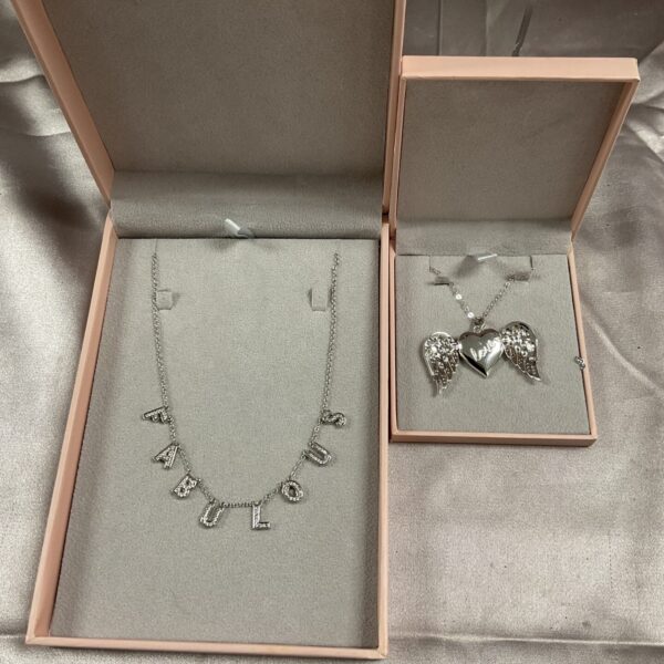 Silver tone Diamonique necklace with delicate angel wing pendants.