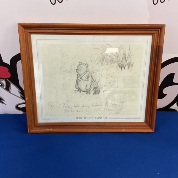 Framed Winnie The Pooh print in pencil drawing style.
