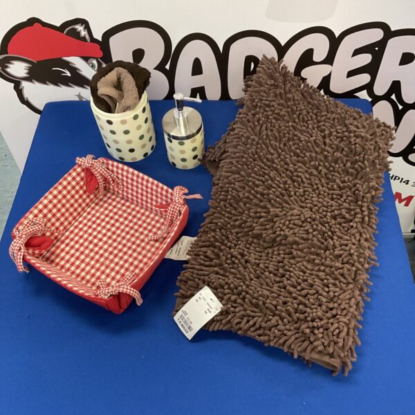 Bathroom accessory lot with bath mat and gingham basket.