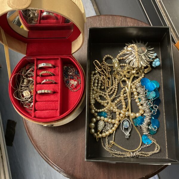 Costume jewellery lot with a small jewellery box included.