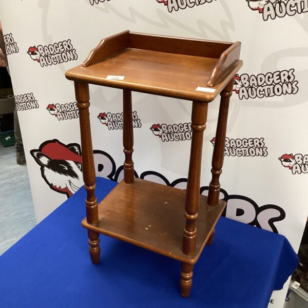 Antique mahogany side table with circular top and cabriole legs.