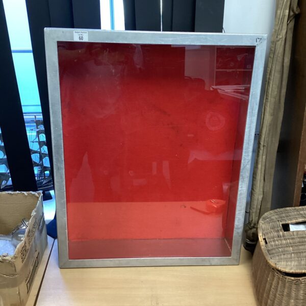 Vintage metal display case with glass front for collectors.