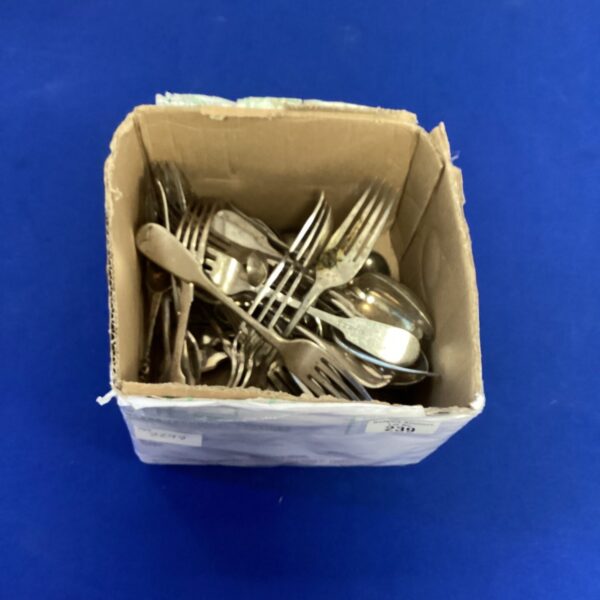 Vintage silverplate cutlery lot in a cardboard box.