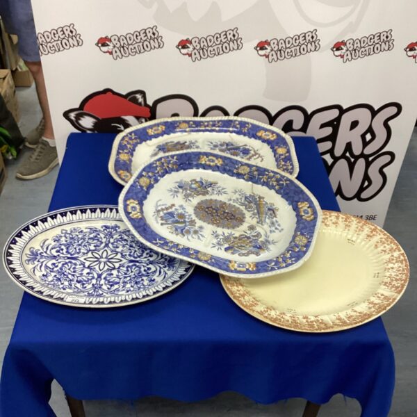 Vintage porcelain meat plates with floral transferware design.