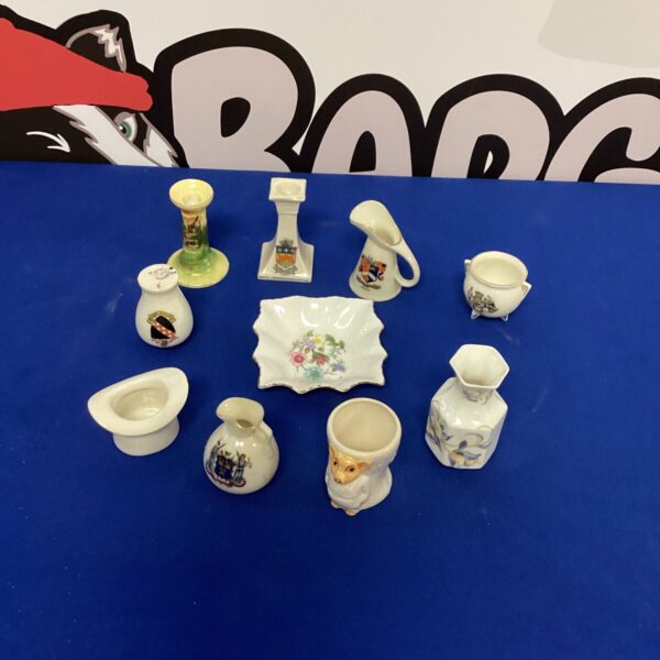 Vintage miniature china trinkets displayed on a surface.