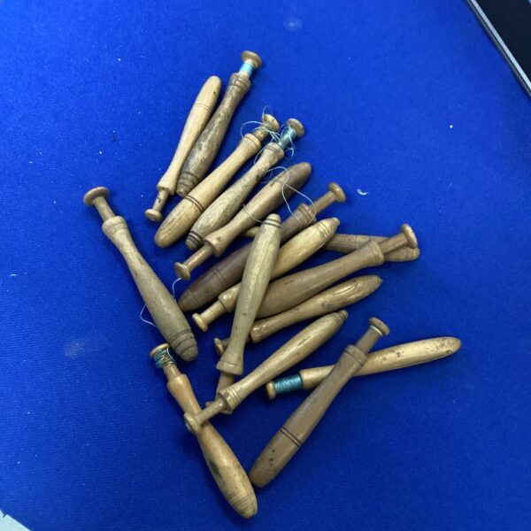 Lot of vintage lace bobbins for crafting and collecting.