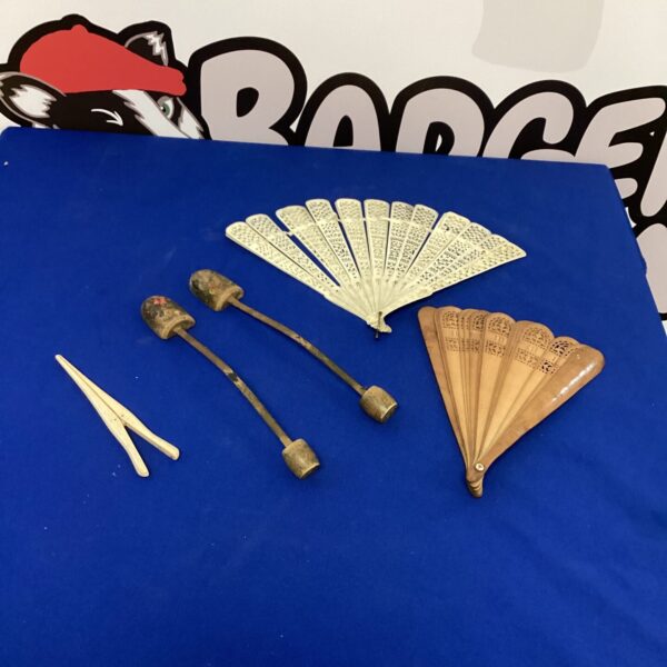 Antique fans and shoe stretchers, vintage collectibles, Victorian era.